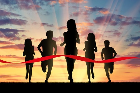 Running sports. Five runners and red tape that crosses a winnerの写真素材