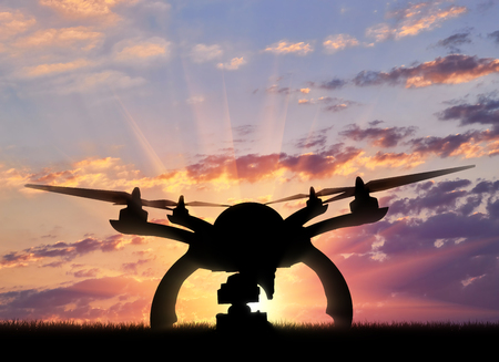 Silhouette drone taking off outdoors. Concept quadrocoptersの写真素材