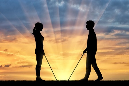 Blind men and women with disabilities with cane stay on street sunset. Concept help blind people with disabilitiesの写真素材