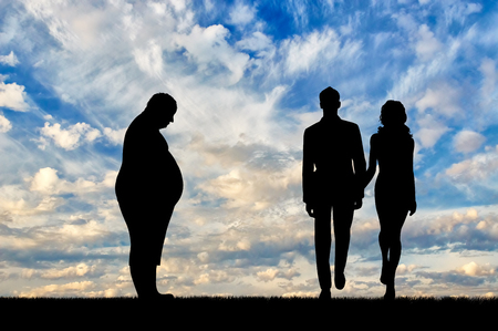 Fat man and thin young couple standing on background sky. Concept obesityの写真素材