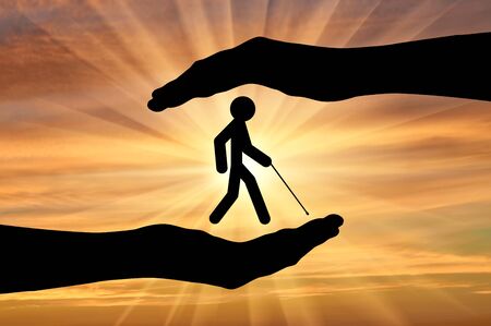 Icon blind with cane in hands on sunset. Concept protection of people with disabilitiesの写真素材