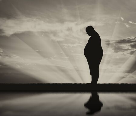 Fat man and reflection in water black and white. Concept obesityの写真素材