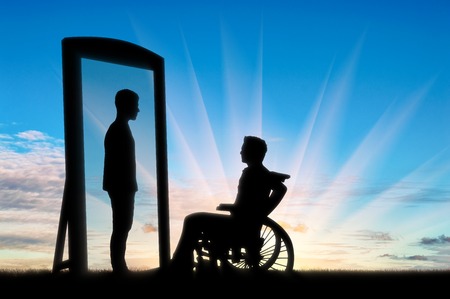 disabled man in a wheelchair and his reflection in the mirror of a healthy man against the sky. Rehabilitation conceptの写真素材