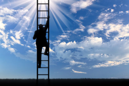 Man climbs the stairs to sky. motivation conceptの写真素材
