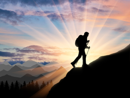 Silhouette climber ascending to the top of mountain. Concept power and motivationの写真素材