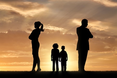 Conflict and divorce in the family. Sad children and parents turned away from each otherの写真素材