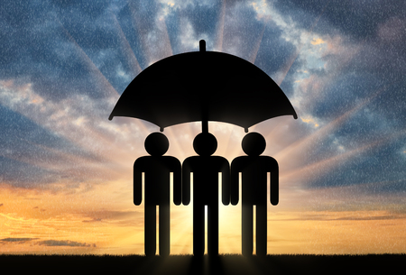 Three icons of little men stand under umbrella together. Concept of social securityの写真素材