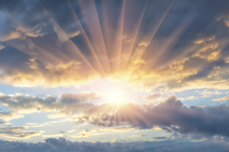 Beautiful evening sunset with clouds and sun raysの写真素材