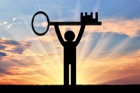 Flat icon man holds the key at sunset. Concept of securityの写真素材