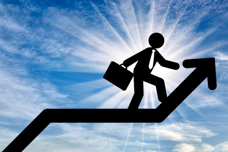 Concept of business purpose. Businessman with briefcase walking on the arrow chart upの写真素材
