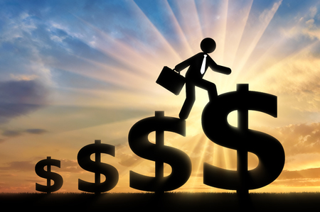 Concept of purpose and success. Businessman with briefcase walking on symbol of the big dollarの写真素材