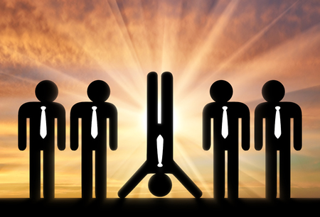 Stand out from the crowd concept. Man standing on hands stands out among ordinary people standing upの写真素材