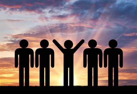 Stand out from the crowd concept. Man with raised arms among ordinary peopleの写真素材