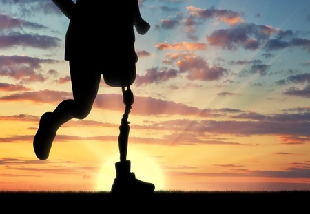Concept of disability. Man with prosthetic leg runningの写真素材