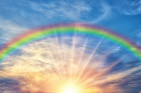 Beautiful evening cloud of the sunset with a rainbow and sunshine after rainの写真素材