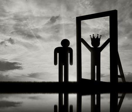 Concept of narcissism and selfishness. Silhouette of an icon of a man standing at a mirror and sees himself in a reflection of the great and with a crown on his headの写真素材
