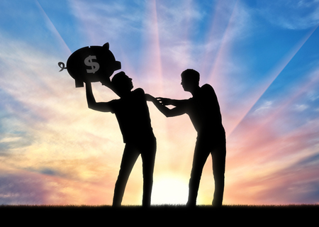 The concept of greed and selfishness. Silhouette of a man trying to take from another man a piggy bank with moneyの写真素材
