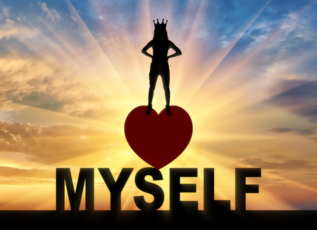 Concept of narcissism and selfishness. Silhouette of a narcissistic woman with a crown on her head.の写真素材