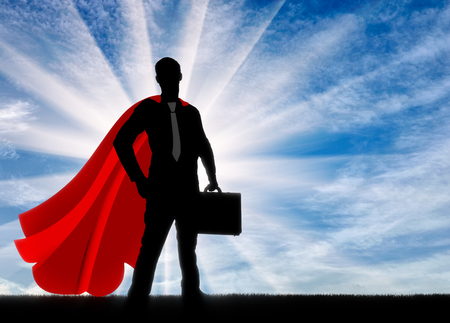 Superman is a businessman superhero. Silhouette of a confident and strong superman businessman with a briefcase at dawnの写真素材