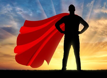 Superman businessman superhero. Silhouette of confident and strong businessman superman at sunsetの写真素材