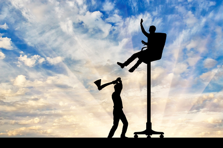 The rival is chopping an armchair on which the person sits high. The concept of a career ladderの写真素材