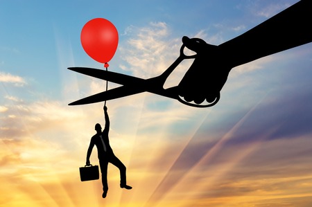 A man climbs up holding onto a balloon, and a hand with scissors intends to cut it off. The concept of a rivalの写真素材