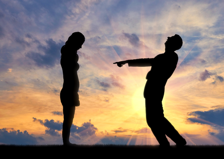 A man laughs at a woman pointing at her with a finger. The concept of shame and disgraceの写真素材
