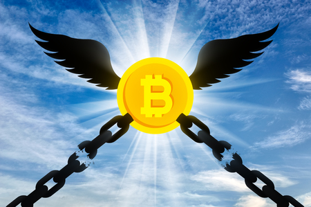 The bitcoin with wings flies up and tears the chains chained to it. The concept of legalization of crypto currencyの写真素材