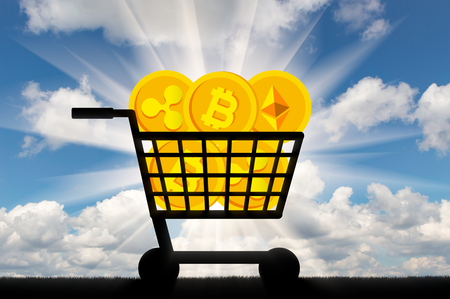 Coins of crypto currency lie in the grocery cart. The concept of buying and selling of crypto currencyの写真素材