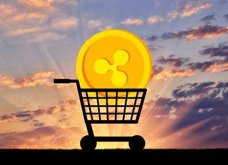 Ripple lies in the grocery cart. The concept of buying and selling of crypto currencyの写真素材