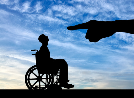 Hand employer refuses the disabled person in a wheelchair to employ him for work. The concept of discrimination and inequality for people with disabilitiesの写真素材