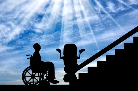 Disabled in wheelchair intends to climb elevator for disabled. Concept disabled lift, elevator, handicapの写真素材