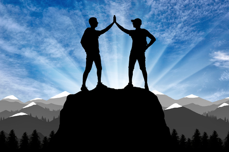 Silhouette of two happy climber conquered the top. Conceptual Sceneの写真素材
