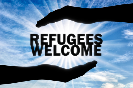 Refugees welcome, words are in the hands of a man. Concept, Europe is ready to help and accept refugeesの写真素材