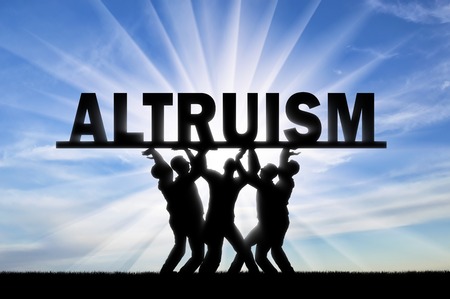 Group of altruistic people hold the word altruism over them. The concept of altruism in societyの写真素材