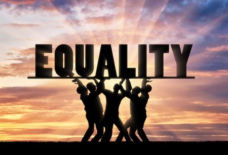 A group of people hold the word equality over them. The notion of equal rights in societyの写真素材
