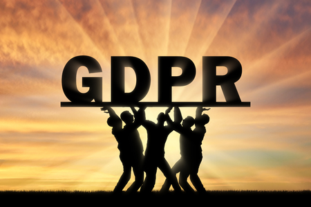 A group of people hold the word GDPR above them. Conceptual image about the law GDPRの写真素材