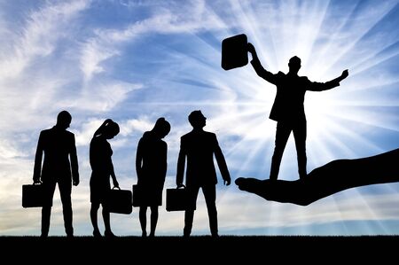 Concept hiring process. Sad crowd of potential candidates and boss hand who chose a man for the positionの写真素材