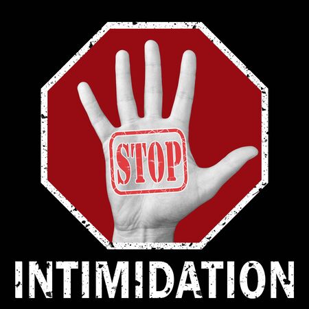 Stop intimidation conceptual illustration. Open hand with the text stop intimidation. Global social problemの写真素材