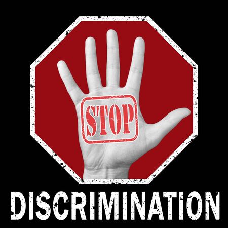 Stop discrimination conceptual illustration. Open hand with the text stop discrimination. Global social problemの写真素材
