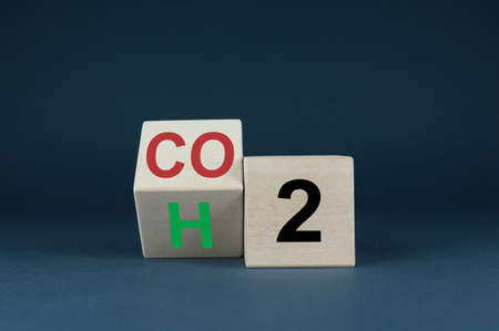 From CO2 to H2, the cubes form an expression. Concept of Transition to cars and not only with green energyの写真素材