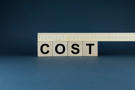 Cost, expense or company profit and loss concept. Word cost form cubes. business and finance conceptの写真素材