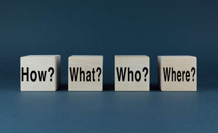 Brainstorming or decision making concept. Cubes form the words How, what, who, where, questions - uncertaintyの写真素材
