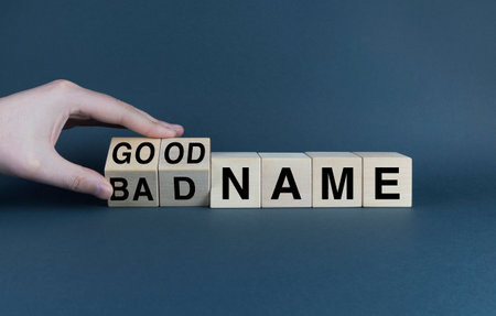 reputation. Cubes form the words Bad name or good name. Reputation concept in businessの写真素材