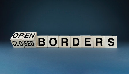 open or closed borders. Cubes form words Open or closed borders. The concept of restrictions on entry or exit to the countries of the world during quarantine, wars or refugeesの写真素材