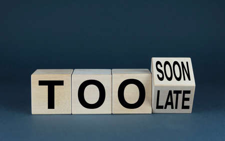 Too soon or too late. Cubes form the words Too soon or too late. Concept of business and timeの写真素材