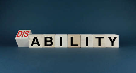 Disability or Ability. Cubes form the words Disability or Ability. Disability conceptの写真素材