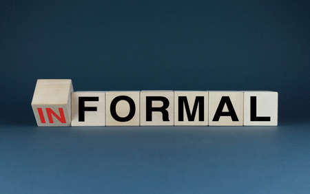 informal or formal. Cubes form words Informal or formal. The concept of Informal or formal environment, behavior or dress codeの写真素材