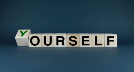 yourself or ourself. Cubes form the words Yourself or ourself. business and lifestyle conceptの写真素材