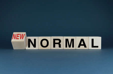 new normal. Cubes form the words New Normal. A broad concept of changes from everyday life to global changes in different areas of activityの写真素材